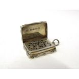 A Fredrick Mardon silver vinaigrette, Birmingham 1873 with pierced grill, shaped body, 3.