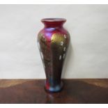 An Okra iridescent glass vase decorated with flowers of tapering form,