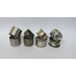 Eight various silver napkin rings,