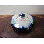 A Chelsea Works Burslem lustre lidded pot designed by Lisa. B.