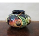 A Walter Moorcroft 'Queens Choice' squat form vase designed by Emma Bossons, 12cm tall,