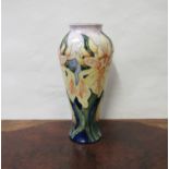 A Walter Moorcroft slender baluster vase tube lined and painted with 'Windrush' pattern, 21cm tall,