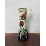 A Walter Moorcroft red tulip pattern jug designed by Anji Davenport, marks to base,