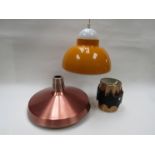 Three ceiling pendant shades in anodised copper finish and yellow