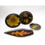 Four poole Aegean pottery leaf pattern dishes,