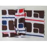 A large piece of 1970's vintage fabric vibrantly printed in abstract brown red and blue