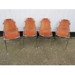 A set of four chrome and brown leather Arc chairs by Charlotte Perriand