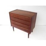 A Danish teak chest of four drawers.