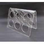 An acrylic wine bottle rack