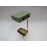 A green painted adjustable desk lamp with brass arm