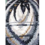 A large Danish Rya rug with grey and white abstract design.