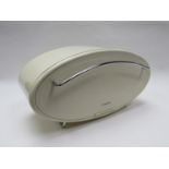 A retro 'Typhoon' oval enamel bread bin with chromed handle fall down front