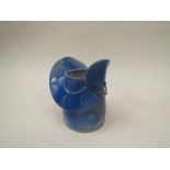 Blue glazed wheel turned studio pottery jug with applied slab work and sprigged decoration 13.
