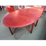 A Kurt Ostervig Danish teak oval drop leaf dining table raised on 'V' shaped supports, circa 1960's,