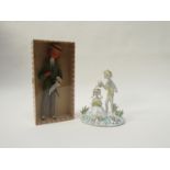 A Raymond Peynet art pottery figurine of a man and a woman produced by Rosenthal pottery,
