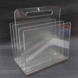 A lucite magazine rack