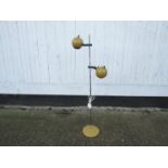 A vintage 1970's mustard coloured ball lamp with twin adjustable spots