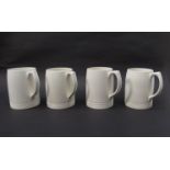 Four Keith Murray Wedgwood tankards in white glaze (chip to bottom underside of one), 12.