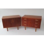 A G-Plan teak side cabinet with twin doors raised on turned teak legs together with a matching