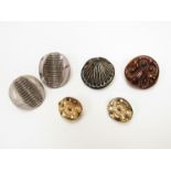 A collection of buttons and a pair of vintage glass clip earrings,