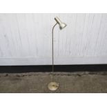 A brassed standard lamp with adjustable single spot