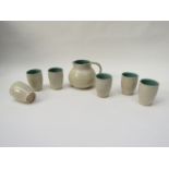 A Claverdon Pottery lemonade jug and six tumblers