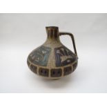 A large West German art pottery pitcher by Ceramano, lava glaze with panels of motifs,