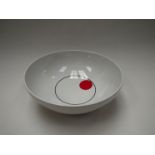 An Italian Melamine 'Giostyle' bowl in white with black line and red dot detail, 23.