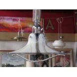 A rise and fall textured lucite ceiling lamp with chromed metal fittings