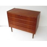 A Danish teak chest of four drawers. 88.