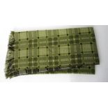 A welsh wool throw in green,