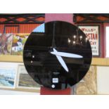 A Karlsson mirage black glass mirror wall clock,