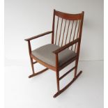 Arne Vodder for Sibast- an oak rocking chair with spindle back, re-upholstered seat pad.