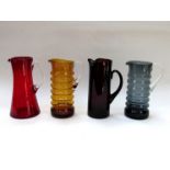 Four assorted 1960's water jugs in amber, red,