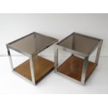 A pair of Merrow Associates style side tables in Brushed stainless steel with smoked glass tops and