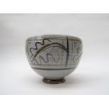 WILLIAM RUSCOE: (1904-1990) A studio pottery bowl painted with oak leaf design, 21cm diameter,