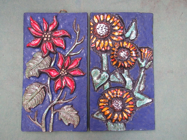 Two West German wall plaques with floral relief design,