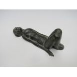 A plaster filled metal figure of a nude female, indistinctly signed to base,
