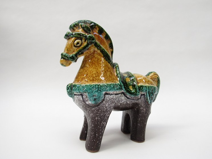 A mid Century Italian pottery horse in the style of Aldo Londi, yellow, green,