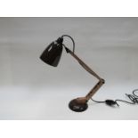 A brown 'mac' lamp with resin arm