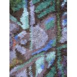 A large Danish Rya rug with blue abstract design.