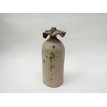 A Studio pottery vase with green tinged ash glaze and flared top,