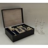 A set of four Royal Leerdam crystal candle holders designed by Andries Dirk Copier set in a black