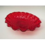 A 1950's large red Murano glass bowl with gold/foil inclusions.