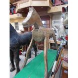 A wooden folk art rocking horse