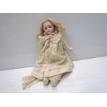 A bisque head, kid body blonde girl doll,