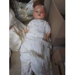 A composition head and limb German baby doll with sleeping eyes