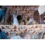 A dome top chest containing mixed teddy bears including seal and monkey