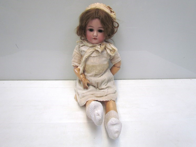 A bisque head, composition body girl doll, 52cms,