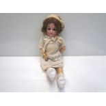 A bisque head, composition body girl doll, 52cms,